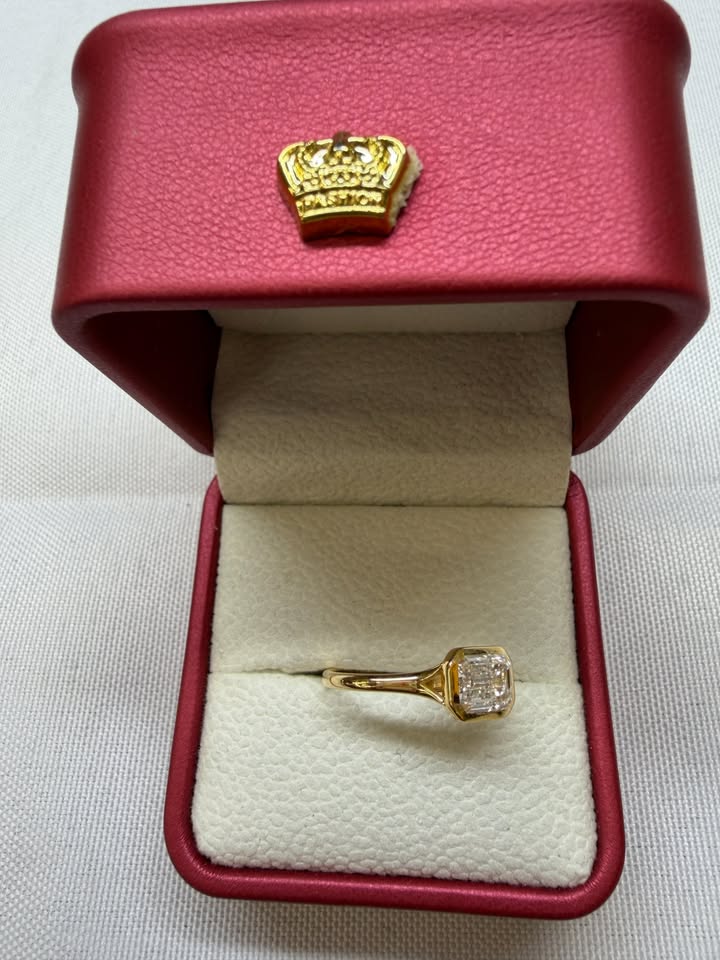 Emerald cut east-west bezel ring, side view