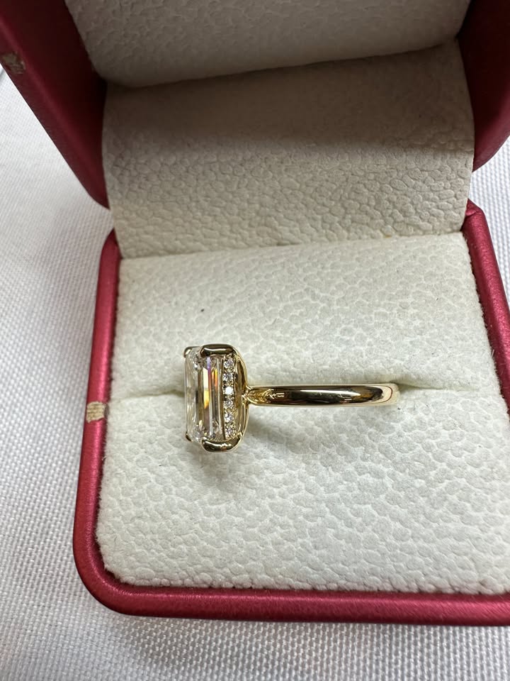 Emerald cut solitaire ring, side view