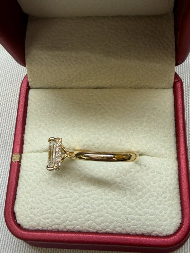 Emerald cut hidden halo ring, side view
