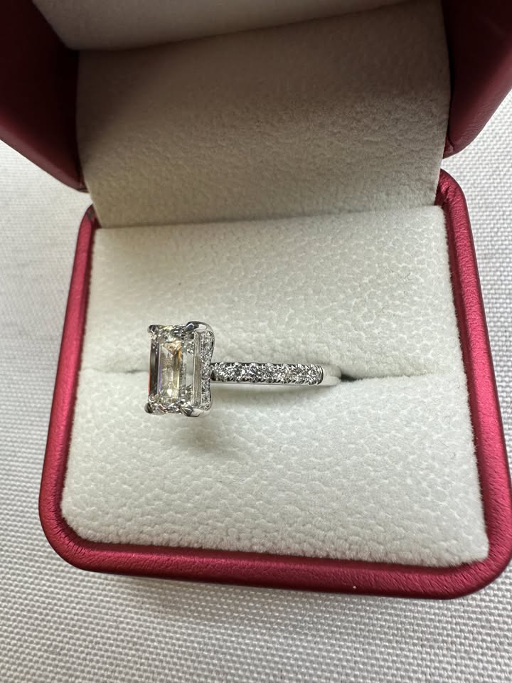 Emerald cut hidden halo pave ring, side view