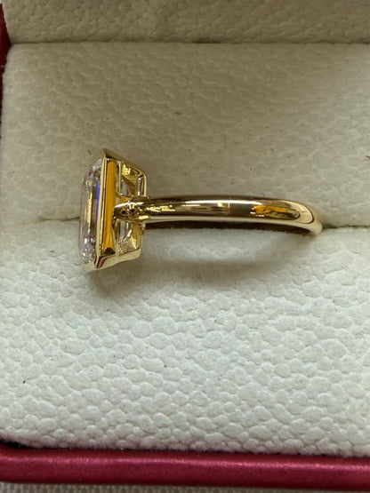 Emerald cut bezel ring, side view