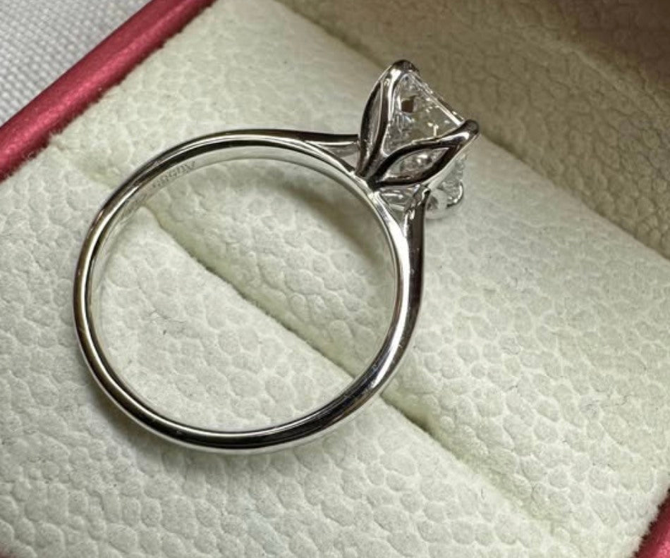 Emerald cut cathedral ring, floral prongs