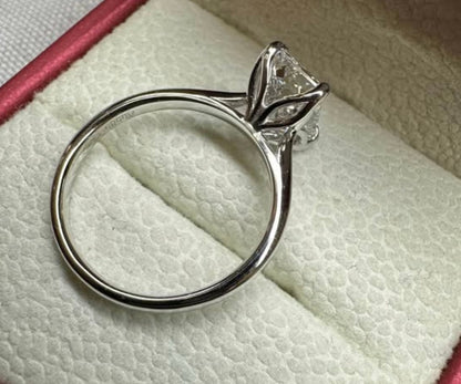 Emerald cut cathedral ring, floral prongs